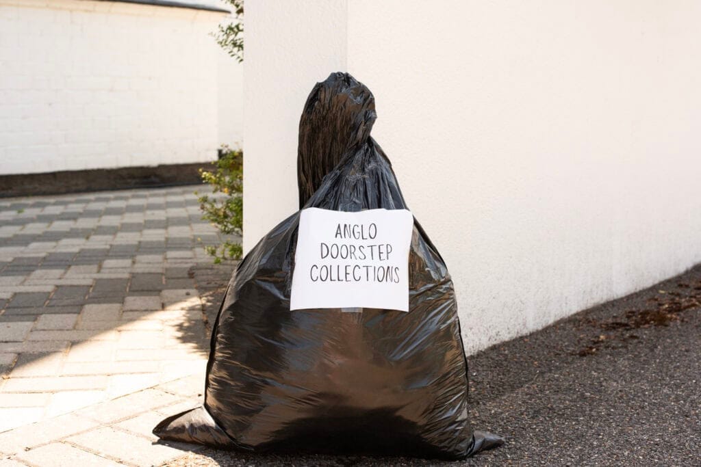 Bag of donations on doorstep.